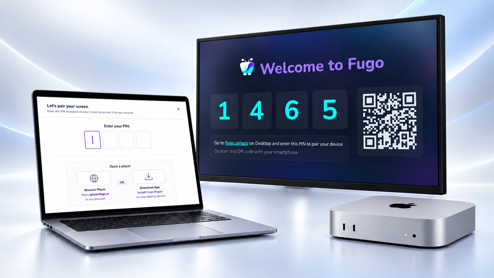 Mac mini playing the Fugo welcome and pairing screen beside a laptop open to the CMS pairing step