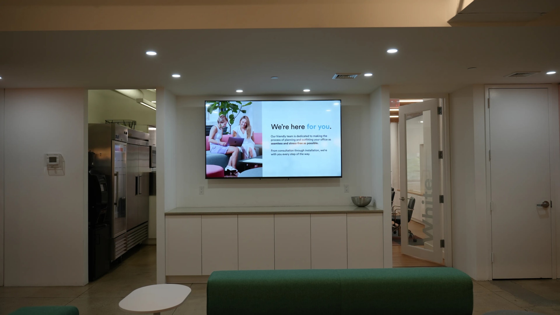 Executive dashboard displayed on a screen in a boardroom showing company-wide KPIs