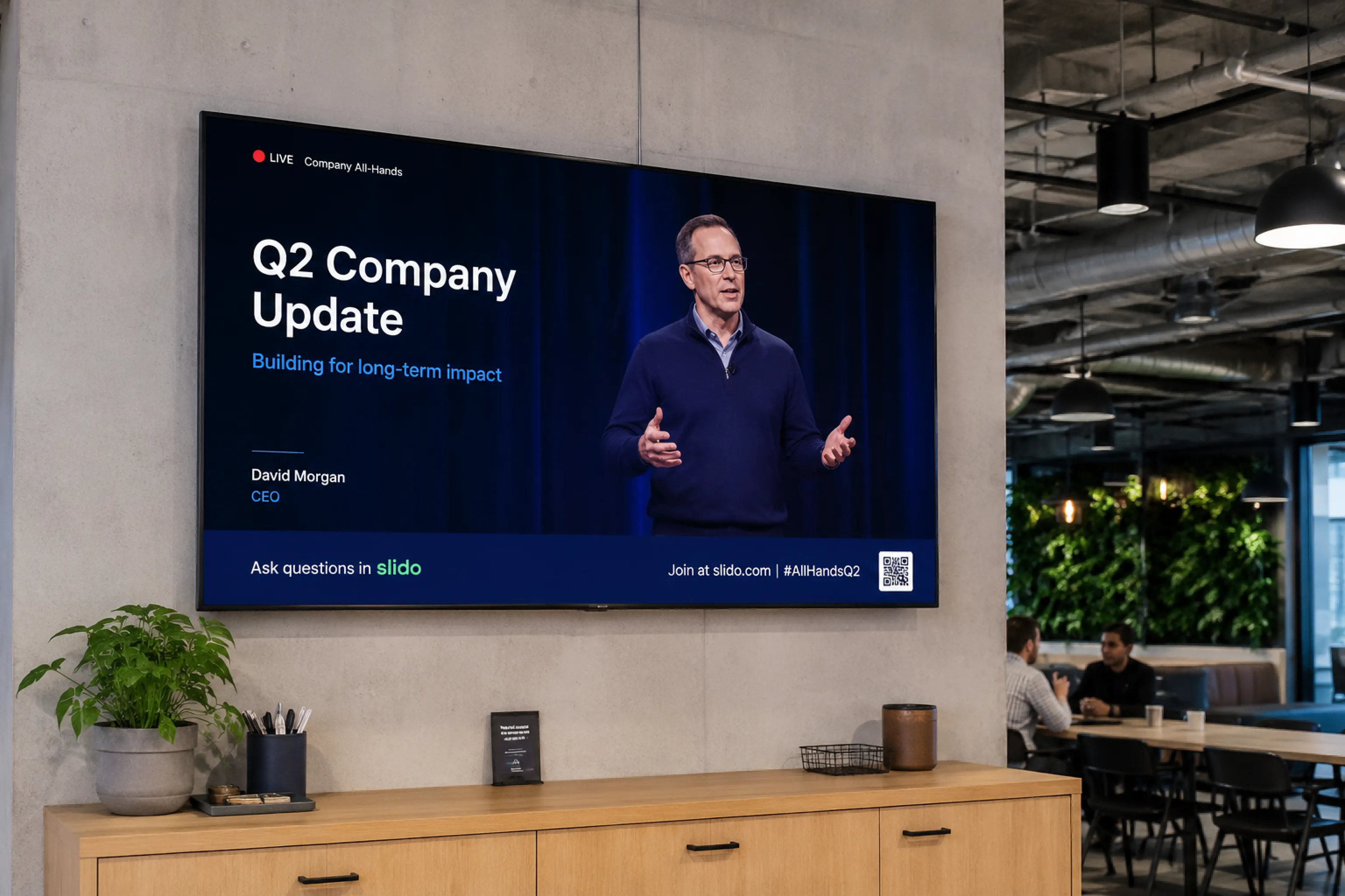 Office screen showing a company-wide all-hands update to staff