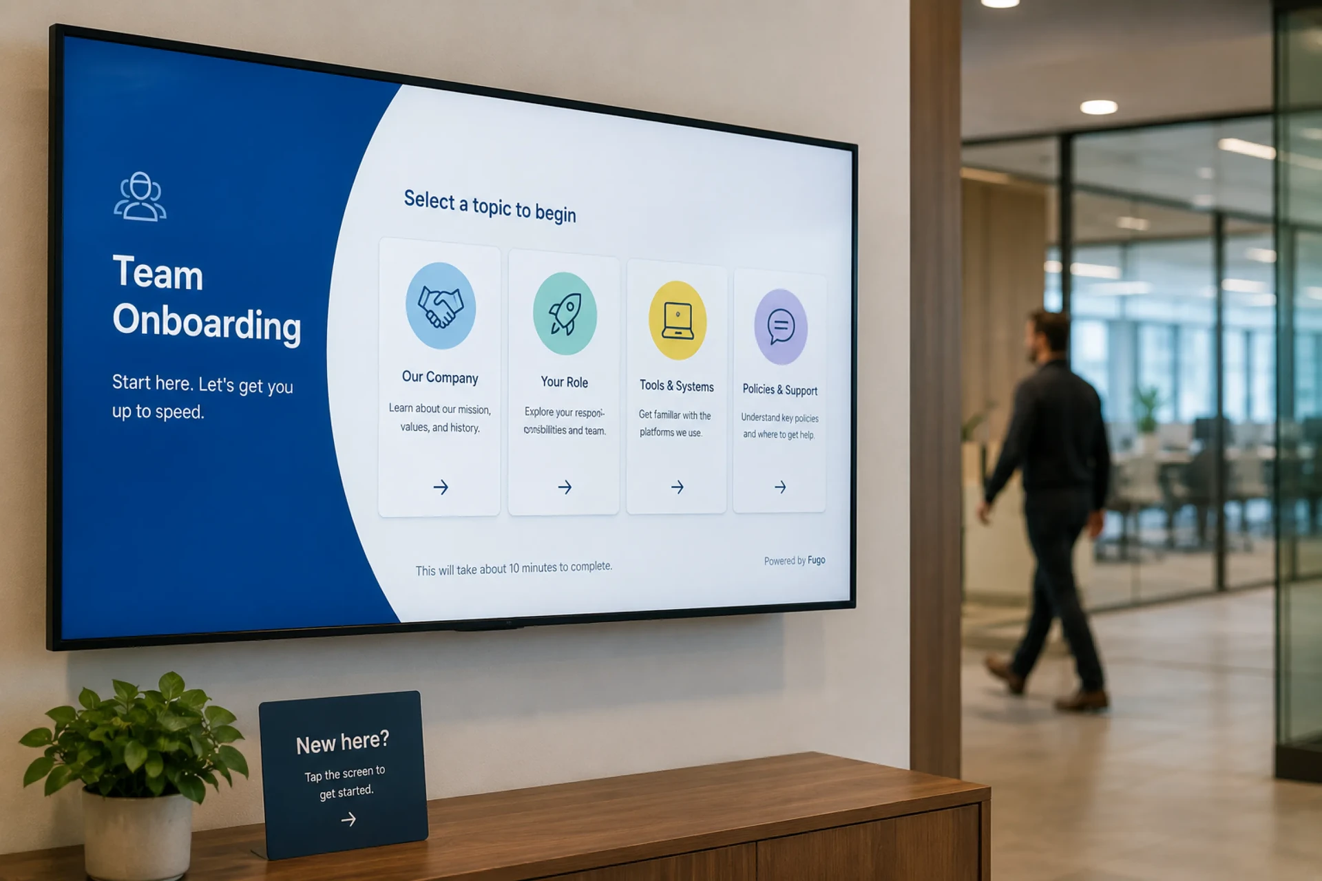 Wall-mounted touch directory in an office reception guiding an arriving visitor